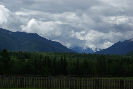 Mountain landscape. Highlands, the mountain peaks, gorges and valleys. The stones on the slopes.