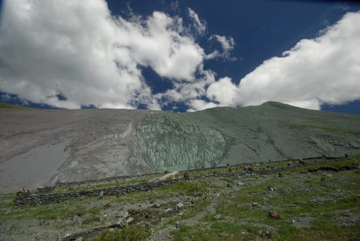 Mountain landscape. Highlands, the mountain peaks, gorges and valleys. The stones on the slopes.