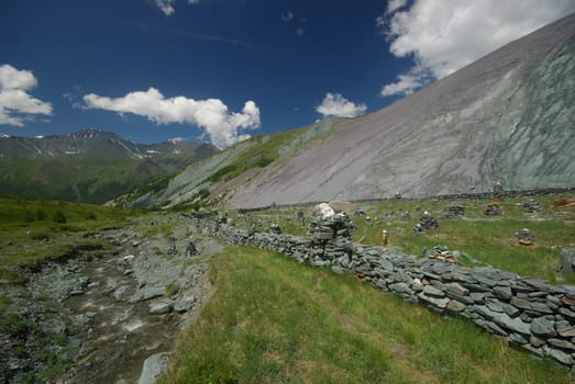 Mountain landscape. Highlands, the mountain peaks, gorges and valleys. The stones on the slopes.