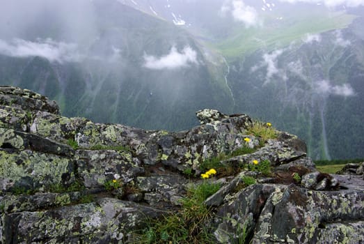 Mountain landscape. Highlands, the mountain peaks, gorges and valleys. The stones on the slopes.