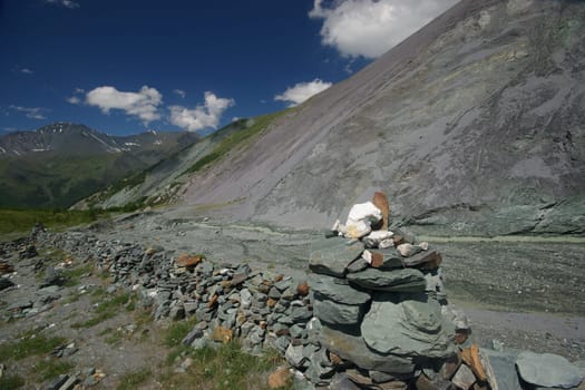 Mountain landscape. Highlands, the mountain peaks, gorges and valleys. The stones on the slopes.