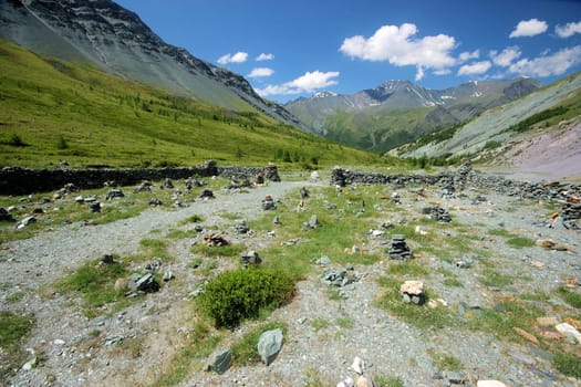 Mountain landscape. Highlands, the mountain peaks, gorges and valleys. The stones on the slopes.