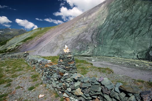 Mountain landscape. Highlands, the mountain peaks, gorges and valleys. The stones on the slopes.