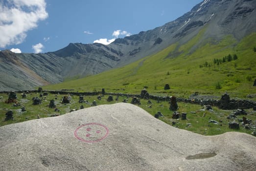 Mountain landscape. Highlands, the mountain peaks, gorges and valleys. The stones on the slopes.