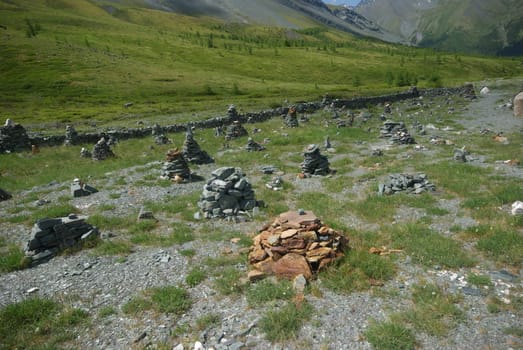 Mountain landscape. Highlands, the mountain peaks, gorges and valleys. The stones on the slopes.