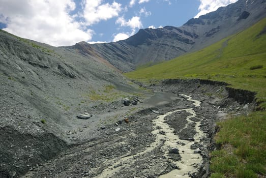 Mountain landscape. Highlands, the mountain peaks, gorges and valleys. The stones on the slopes.