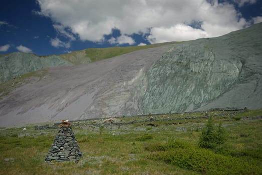 Mountain landscape. Highlands, the mountain peaks, gorges and valleys. The stones on the slopes.