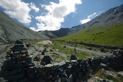 Mountain landscape. Highlands, the mountain peaks, gorges and valleys. The stones on the slopes.