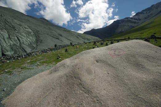 Mountain landscape. Highlands, the mountain peaks, gorges and valleys. The stones on the slopes.
