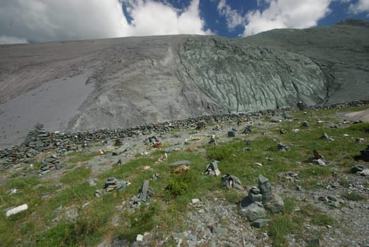 Mountain landscape. Highlands, the mountain peaks, gorges and valleys. The stones on the slopes.
