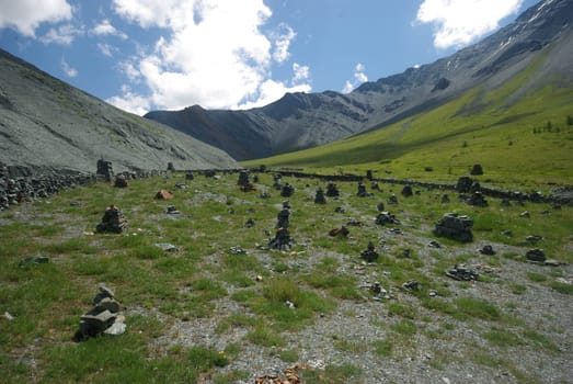 Mountain landscape. Highlands, the mountain peaks, gorges and valleys. The stones on the slopes.