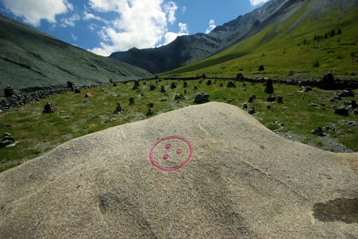 Mountain landscape. Highlands, the mountain peaks, gorges and valleys. The stones on the slopes.
