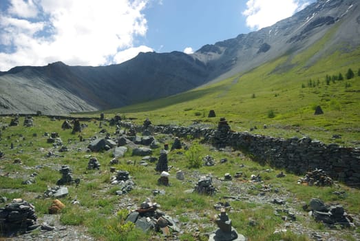 Mountain landscape. Highlands, the mountain peaks, gorges and valleys. The stones on the slopes.