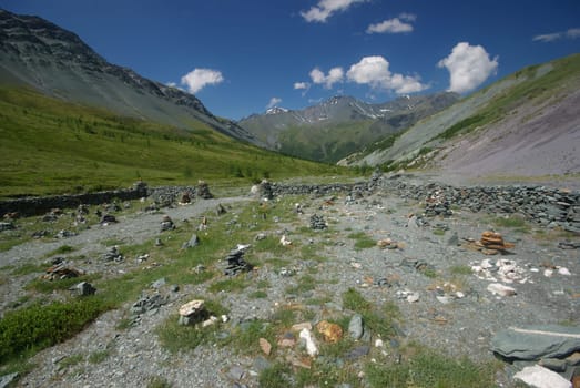 Mountain landscape. Highlands, the mountain peaks, gorges and valleys. The stones on the slopes.