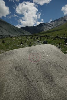 Mountain landscape. Highlands, the mountain peaks, gorges and valleys. The stones on the slopes.