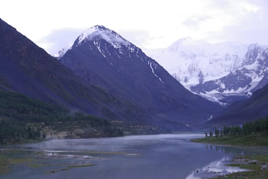 Mountain landscape. Highlands, the mountain peaks, gorges and valleys. The stones on the slopes.