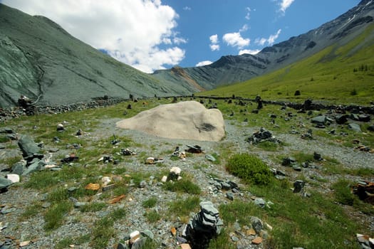 Mountain landscape. Highlands, the mountain peaks, gorges and valleys. The stones on the slopes.