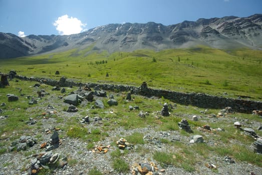 Mountain landscape. Highlands, the mountain peaks, gorges and valleys. The stones on the slopes.