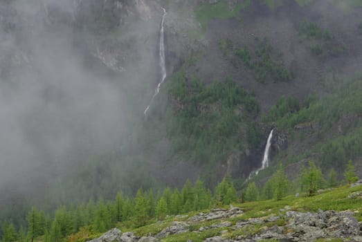 Mountain landscape. Highlands, the mountain peaks, gorges and valleys. The stones on the slopes.