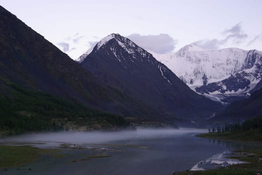 Mountain landscape. Highlands, the mountain peaks, gorges and valleys. The stones on the slopes.