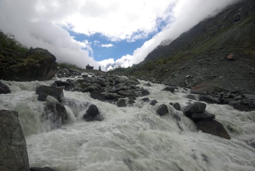 Mountain landscape. Highlands, the mountain peaks, gorges and valleys. The stones on the slopes.