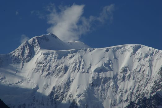 Mountain landscape. Highlands, the mountain peaks, gorges and valleys. The stones on the slopes.