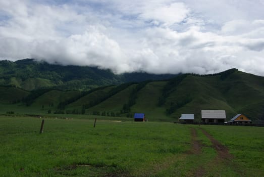 Mountain landscape. Highlands, the mountain peaks, gorges and valleys. The stones on the slopes.