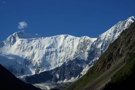 Mountain landscape. Highlands, the mountain peaks, gorges and valleys. The stones on the slopes.