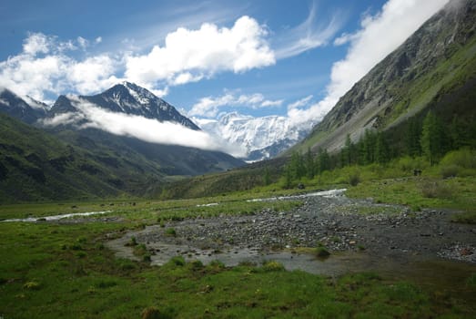 Mountain landscape. Highlands, the mountain peaks, gorges and valleys. The stones on the slopes.