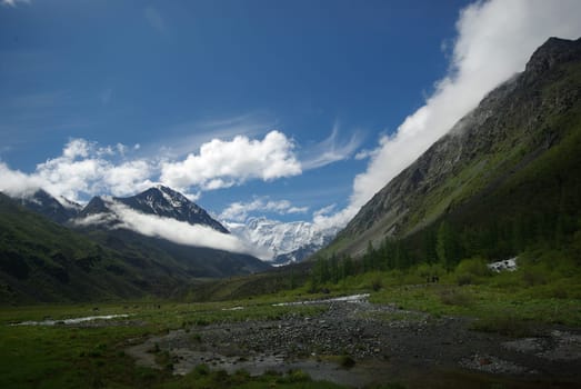 Mountain landscape. Highlands, the mountain peaks, gorges and valleys. The stones on the slopes.