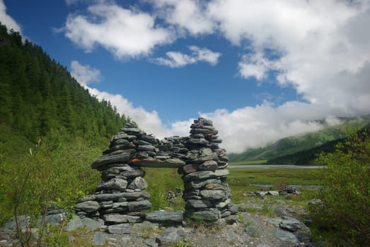 Mountain landscape. Highlands, the mountain peaks, gorges and valleys. The stones on the slopes.