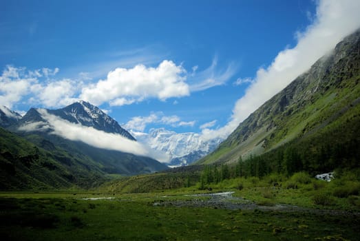 Mountain landscape. Highlands, the mountain peaks, gorges and valleys. The stones on the slopes.