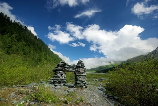 Mountain landscape. Highlands, the mountain peaks, gorges and valleys. The stones on the slopes.