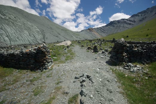 Mountain landscape. Highlands, the mountain peaks, gorges and valleys. The stones on the slopes.
