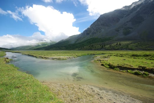 Mountain landscape. Highlands, the mountain peaks, gorges and valleys. The stones on the slopes.