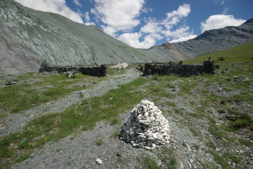 Mountain landscape. Highlands, the mountain peaks, gorges and valleys. The stones on the slopes.