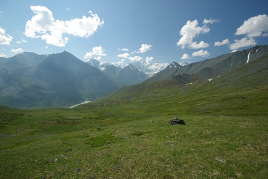 Mountain landscape. Highlands, the mountain peaks, gorges and valleys. The stones on the slopes.