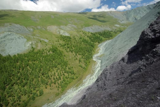 Mountain landscape. Highlands, the mountain peaks, gorges and valleys. The stones on the slopes.