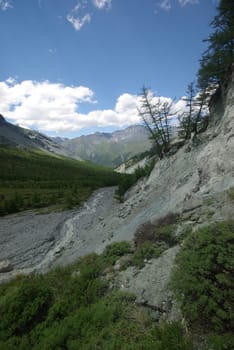 Mountain landscape. Highlands, the mountain peaks, gorges and valleys. The stones on the slopes.