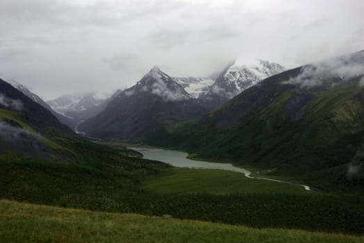 Mountain landscape. Highlands, the mountain peaks, gorges and valleys. The stones on the slopes.