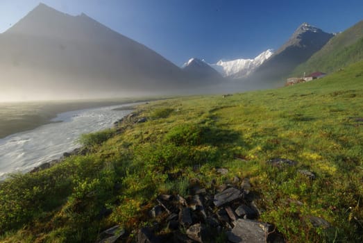 Mountain landscape. Highlands, the mountain peaks, gorges and valleys. The stones on the slopes.