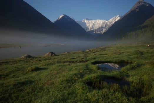 Mountain landscape. Highlands, the mountain peaks, gorges and valleys. The stones on the slopes.