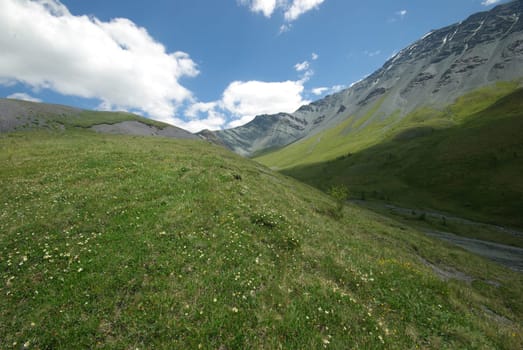 Mountain landscape. Highlands, the mountain peaks, gorges and valleys. The stones on the slopes.