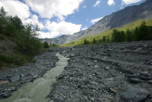 Mountain landscape. Highlands, the mountain peaks, gorges and valleys. The stones on the slopes.