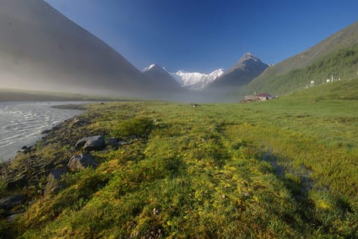 Mountain landscape. Highlands, the mountain peaks, gorges and valleys. The stones on the slopes.