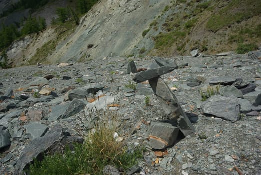 Mountain landscape. Highlands, the mountain peaks, gorges and valleys. The stones on the slopes.