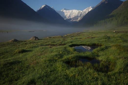 Mountain landscape. Highlands, the mountain peaks, gorges and valleys. The stones on the slopes.