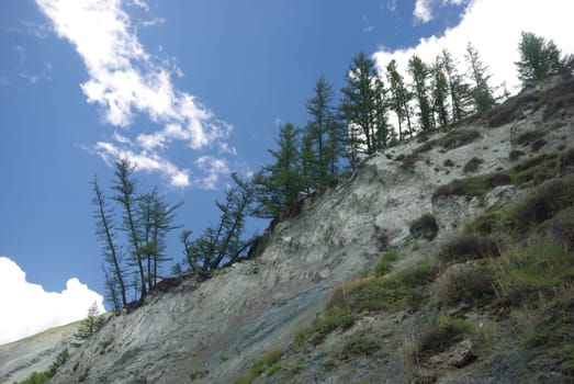 Mountain landscape. Highlands, the mountain peaks, gorges and valleys. The stones on the slopes.