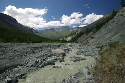 Mountain landscape. Highlands, the mountain peaks, gorges and valleys. The stones on the slopes.