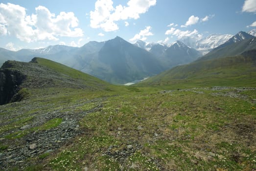 Mountain landscape. Highlands, the mountain peaks, gorges and valleys. The stones on the slopes.